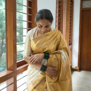 A Classic Ivory and Gold Saree - Image 1
