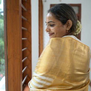 A Classic Ivory and Gold Saree - Image 3