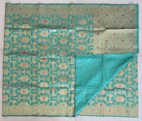 A Blue-Green Katan Banarasi Saree